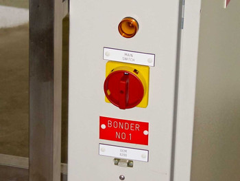 HyBond 616-12 power column side panel showing main rotary switch, amber indicator light, BONDER NO.1 label, and DB9 DEM port