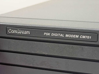 ComStream PSK Digital Modem CM701 nameplate label close-up on front panel bezel