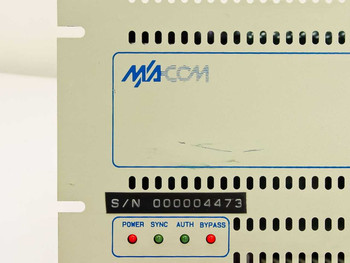 General Instrument VideoCipher II front panel closeup showing MA/COM logo, S/N 000004473 label, and four LED status indicators: POWER, SYNC, AUTH, BYPASS