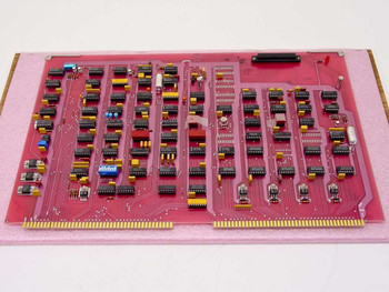 Varian 01002543-00 Control Logic Board Rev M — rear side showing solder side of pink PCB with gold edge connector