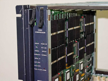 General Instrument CLI Magnitude MPEG Encoder — left-side panel showing Video Compressor module with indicator labels: Analog, PAL, Normal, Composite, Serial D1, Line Lock, Field Lock, Field Filter Alarm, Power On, On-Line, Backup, Transmit