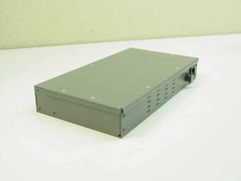 Andrew TRR 8120RJ modem – top and rear view showing vented gray metal enclosure and power cable