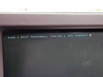 Aydin Controls 5219 CRT terminal screen close-up showing boot message: PAGE 1 5217 TRACKBALL 140-22.1 CRC CORRECT