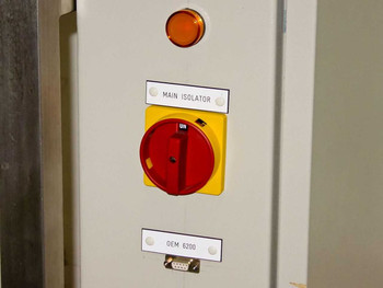 HyBond 616-12 power panel cabinet detail showing main isolator rotary switch, amber indicator lamp, and OEM 6200 DB9 connector