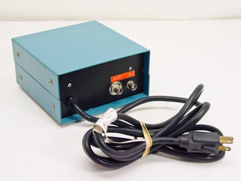 Electronic Shutter Controller rear panel showing BNC IN and OUT connectors with orange label, AC power cord with NEMA 5-15P plug