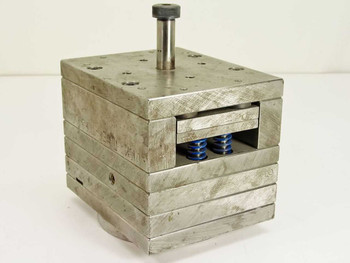 Spring Loaded CD Disk Inner Torsion Unit 20725 – front-right three-quarter view showing stainless steel laminated body and two blue torsion springs in open slot