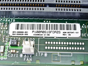 Compaq 296669-001 motherboard label closeup showing part number P100A0G1GF0AZG, SP 296669-001, DQ 006628-000, A8 007047-101, Rev 0Q, Assembled in USA