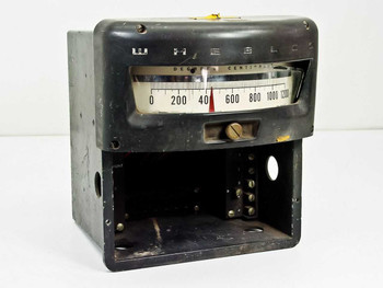 Wheelco Model 402 analog temperature meter front view showing 0–1200°C centigrade scale with red pointer indicator and brass adjustment knob, open bottom compartment with terminal screws visible