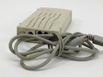 Global Village TelePort Bronze A861 modem – rear three-quarter view showing ports and coiled serial cable