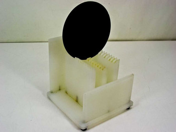 Unbranded 6-inch 150mm 12-slot HDPE benchtop silicon wafer holder — angled three-quarter front view showing full carrier body with a 150mm wafer displayed in the front slot