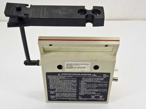 Beckman Expand-Mate pH meter rear panel view showing operating instructions label and probe stand attachment