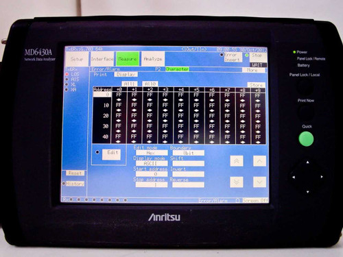 Anritsu MD6430A front panel with touchscreen LCD displaying Measure/Analyze screen with character data table — panel lock, battery, and print now indicators visible on right side