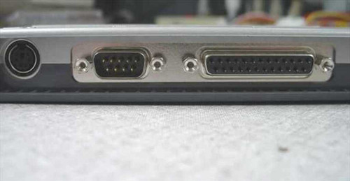 Toshiba PA2728U I/O Adapter Port — close-up of PS/2 Mini-DIN, DB9 serial, and DB25 parallel ports on the connector face
