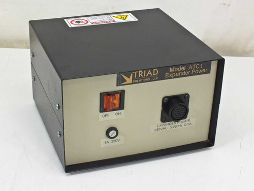 Triad Solutions ATC1 Expander Power Supply — front panel with illuminated ON/OFF rocker switch, 1A 250V fuse holder, and multi-pin circular output connector labeled 230VAC 50/60Hz 0.5A