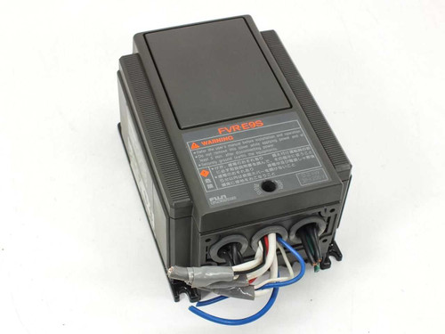 Fuji Electric FVR-E9S VFD inverter — front-top view showing FVR-E9S label and warning placard with wiring leads attached at bottom