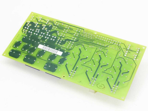 Netstal SIK relay control board reverse/solder side view showing PCB traces and a label on the board back