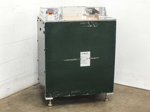 Uni-Solar MX1-711-000-5 corner trim machine — rear/side view showing green painted steel panel and leveling feet