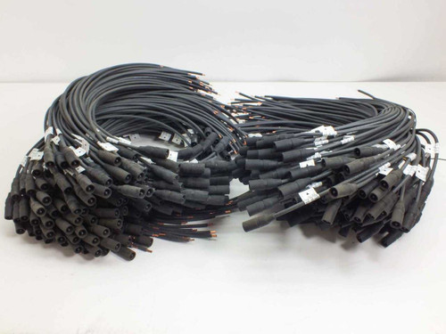 Lot of 100 MC3 male solar panel cables 22 inches long shown coiled on white surface — full lot overview