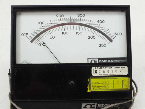 Omega Engineering 7055-J-500 pyrometer front panel close-up showing analog dial scales and Calibration Control tag X765102