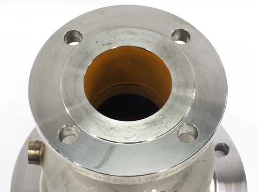 Stainless steel flange reducer – top-down view into small port flange face showing 4 bolt holes and raised face with discoloration inside bore