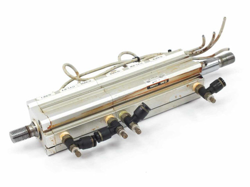 SMC compact pneumatic cylinder pair – side view showing push-in fittings and pneumatic tubing ports along the bottom