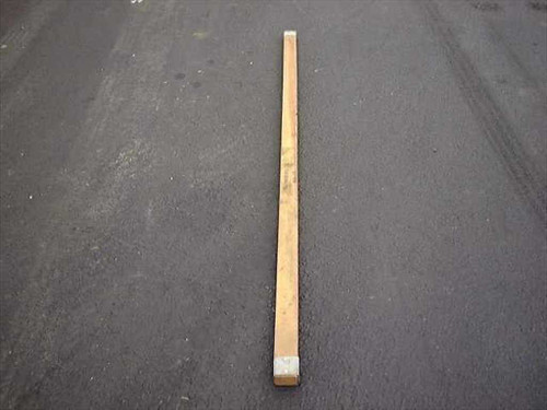 US Tucker Ridge military wood tent pole, 7 feet long, shown full length on pavement — front view