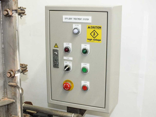 Effluent treatment system control panel labeled 'Effluent Treatment System' with start, stop, emergency stop, and indicator controls