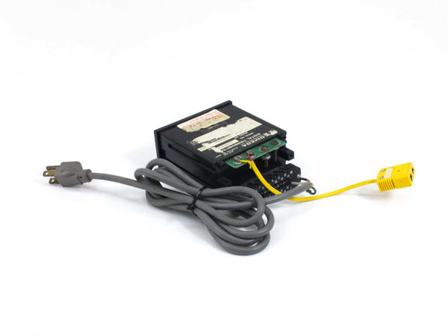 Omega Engineering Model 199 digital thermometer rear three-quarter view showing AC power cord and yellow thermocouple connector