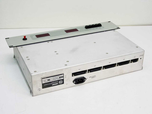Varian VJW1454B Channel Selector Sub-System — angled top-front view showing front panel LED displays, red toggle switch, and multi-port rear connectors