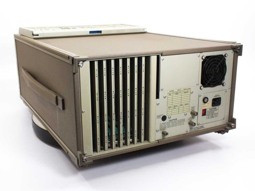 Tektronix DAS 9109 rear panel showing module slots, exhaust fan, power inlet, and trigger input BNC connector