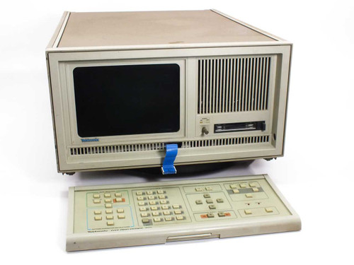Tektronix DAS 9109 Digital Analysis System mainframe front view with detached keyboard and blue handle tag
