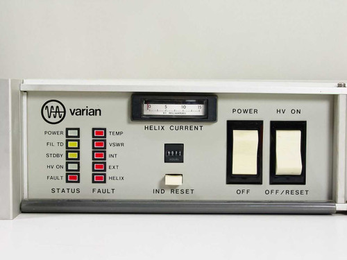 Varian TWTA VZC6961D7W1 front panel close-up showing Varian logo, STATUS/FAULT LED array, HELIX CURRENT analog meter, IND RESET button, POWER and HV ON rocker switches