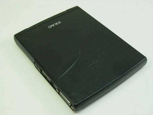 TEAC DVE28E external DVD-ROM drive rear/bottom view showing proprietary connector ports and additional surface scratching