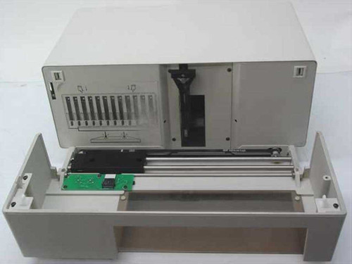 ADIC AutoDAT tape library housing with top cover removed, showing internal chassis with expansion card slots and lower transport rail assembly with PCB