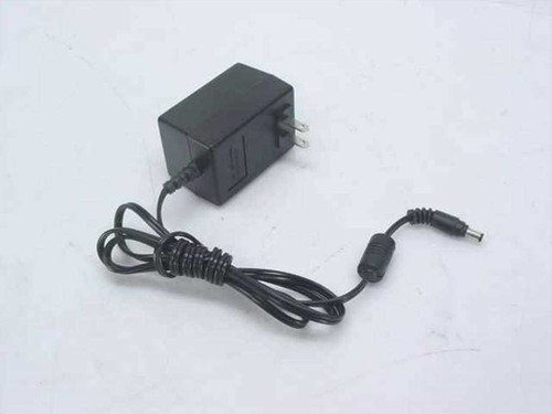 YHI YS-1015-U12 AC adapter full view showing black wall adapter body with attached DC output cable and barrel plug connector