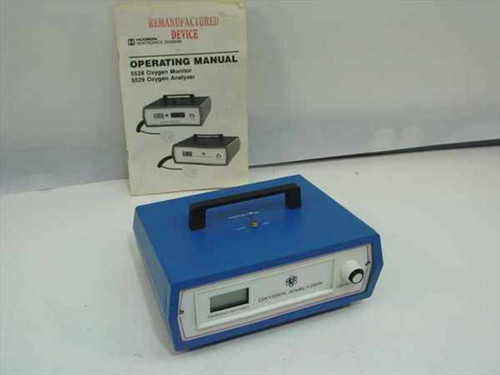 Ventronics 5529 Digital Oxygen Analyzer front panel view with LCD display and operating manual behind it