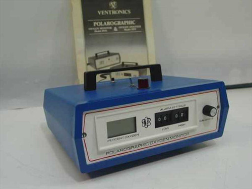 Ventronics 5570 Polarographic Oxygen Monitor front view with LCD display and alarm settings, manual visible in background