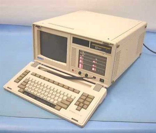 Tekelec TE713 Chameleon 32 Protocol Analyzer front view with integrated CRT display, fold-out keyboard, and floppy drive bay