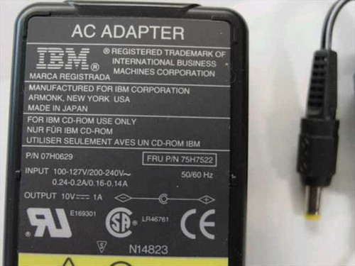IBM 75H7522 AC Adapter label showing P/N 07H0629, FRU 75H7522, input 100-127V/200-240V 50/60Hz, output 10V 1A, UL and CE markings, and barrel plug tip