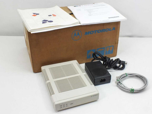 Motorola 650 ISDN modem shown in original Motorola box with power supply, RJ cable, and documentation