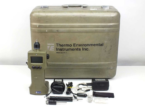 Thermo Environmental 580 EZ organic vapor meter with hard carry case, 2 probes, charger with wall and car adapters, and lamp cleaner laid out in front