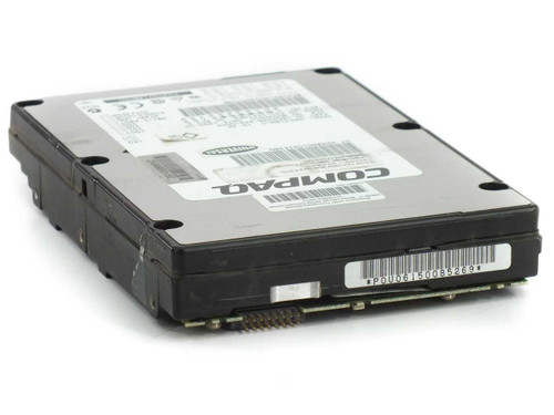 Fujitsu MAE3182LC 18GB SCSI hard drive angled top view showing Compaq label and barcode