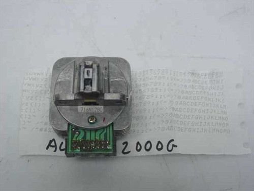Alps P2000G dot matrix printhead front view showing print element and green PCB connector with part number 716N1260 visible on label, placed against printed test sheet