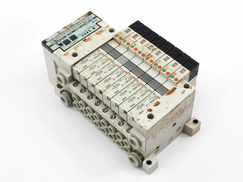 SMC EX120-SSH1 serial interface unit and VQ1200-5 valve manifold assembly – angled rear-right view showing full assembly profile and DIN rail mount