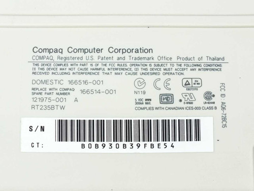 Compaq RT235BTW keyboard bottom label showing part numbers 121975-001, 166516-001, 166514-001, FCC ID, and serial number barcode