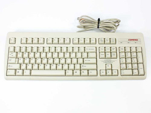 Compaq RT235BTW PS/2 Spacesaver Keyboard 121975-001 — top view showing full key layout and attached PS/2 cable