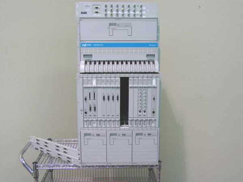 Nortel Passport 6480 multiservice edge switch full system view on cart — chassis with installed cards and Magellan unit above