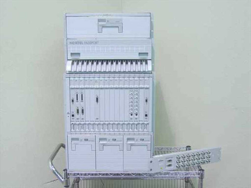 Nortel Passport 6480 complete system front view showing full chassis stack with cards installed on wire shelving