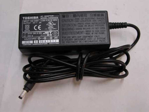 Toshiba CEX0107A AC adapter front view showing label with model number, input/output specs, and attached barrel plug cable