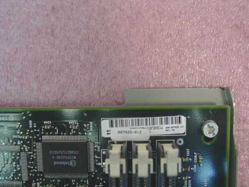 Compaq 007426-012 motherboard close-up of part number label and Winbond chip markings on PCB corner